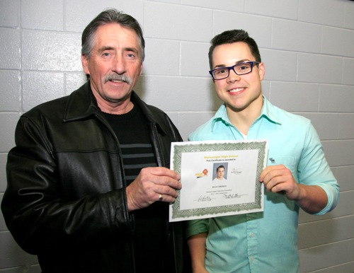 W.Bro. M.E. Rodgers ~ Worshipful Master of Buffalo Park Lodge Presenting Ryan Thomas a grade 12 student at Wainwright High School with the Bill and Molly Riome scholarship.